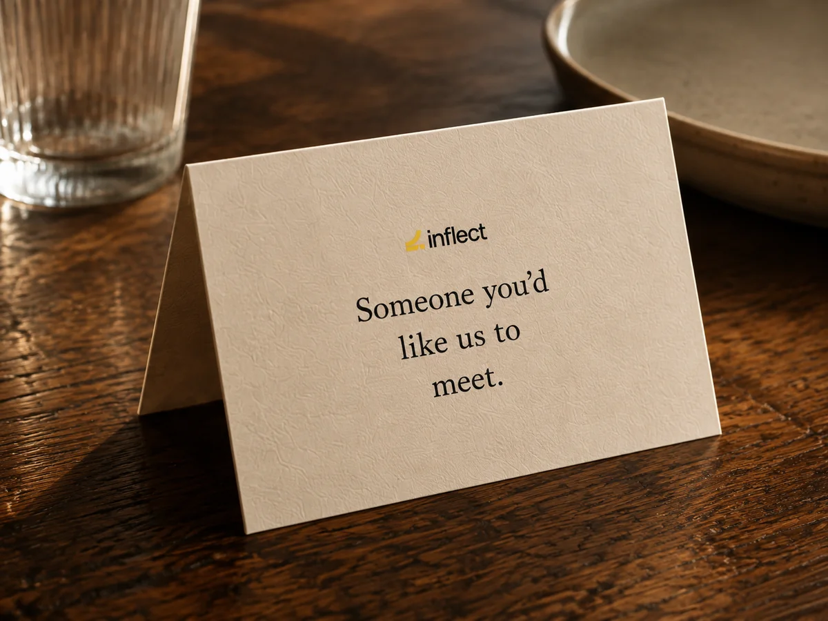 An Inflect place card on the table reads: Someone you’d like us to meet.